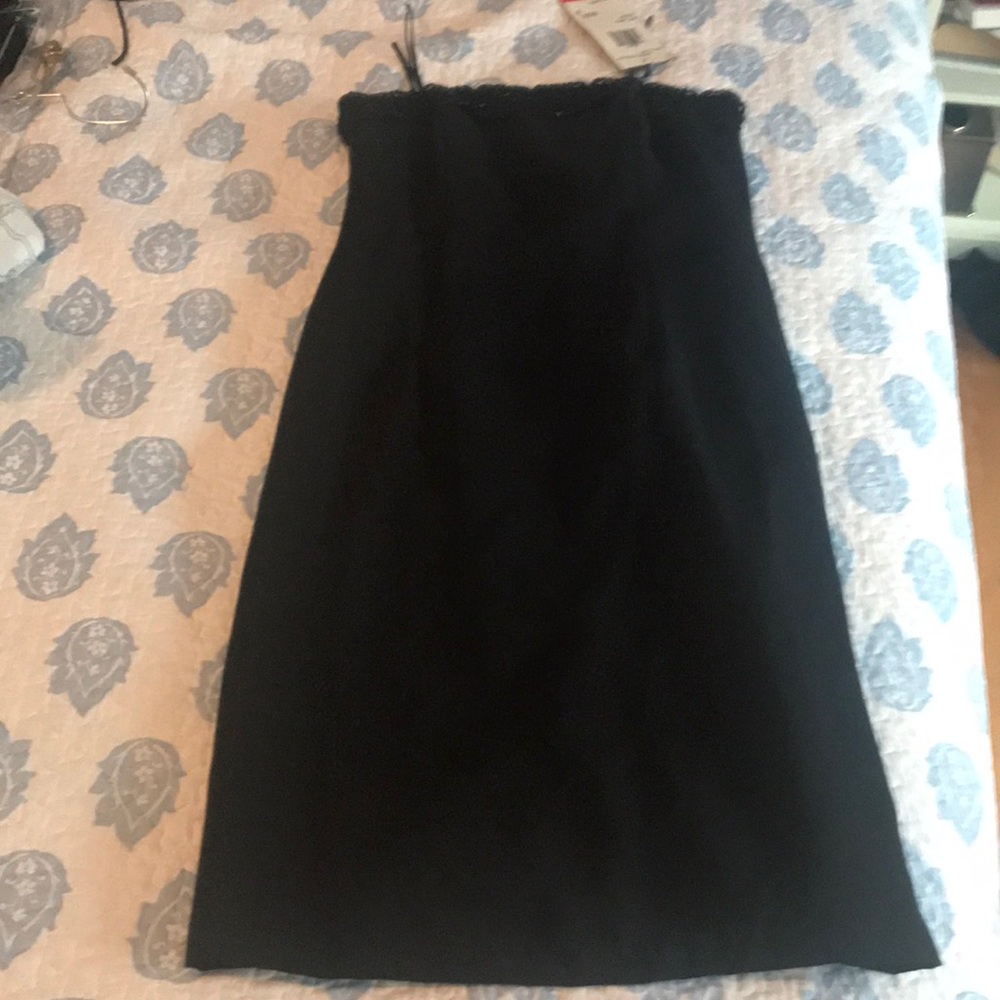 Black never worn strapless dress. Tags on.